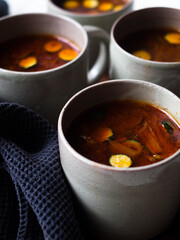 Gut healing bone broth with paprika and zucchini slices.