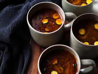 Gut healing bone broth with paprika and zucchini slices.