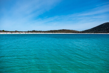 Fototapeta premium View of the coast of the Freycinet Peninsula, Tasmania from a boat on a sunny day