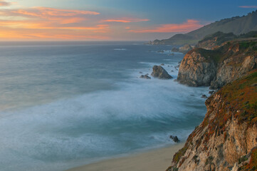 Landscape of the shoreline of the Pacific Ocean near sunset south of Monterey, California, USA