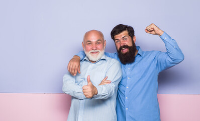 2 generation. Relationships. Old dad and young son. Old man and young man. Old dad and adult son. Bearded man. Two bearded man.