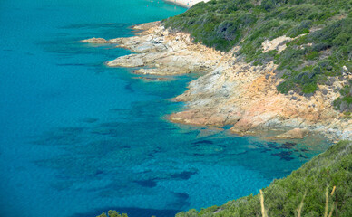 Fototapeta na wymiar Panoramic view of the rocky coast with clear transparent blue water, near Ajaccio, Corsica, France