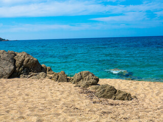 Beautiful beach with golden sand, rocks and the turquoise Mediterranean Sea, Liamone Beach near Ajaccio, Corsica,