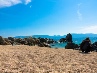 Fototapeta na wymiar Beautiful beach with golden sand, rocks and the turquoise Mediterranean Sea, Liamone Beach near Ajaccio, Corsica,
