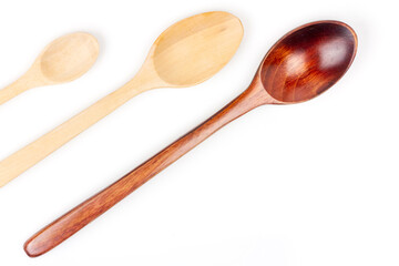 Close-up three wooden spoon isolated on white background.