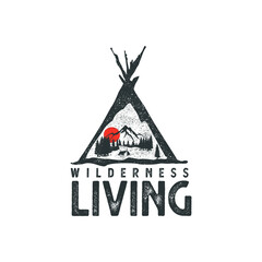 Hand drawn wilderness badge with mountain landscape and inspiring lettering 