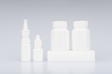 White unbranded medications on light grey background