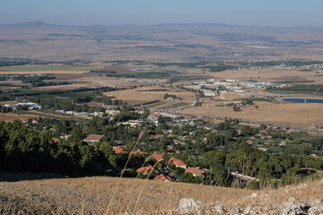 Fototapeta premium View of Hula Valley with Rosh Pina town and the Galan Heights in the east, Mount Hermom in the north and Lake Kinneret in the south as seen from Mount Canaan slopes, Upper Galilee, Israel. 