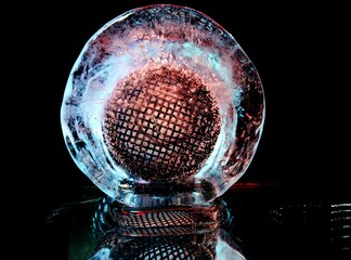 black metal mesh frozen in ice in creative macro photography
