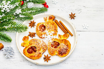 Christmas or New Year sweet apple puffs with festive decor