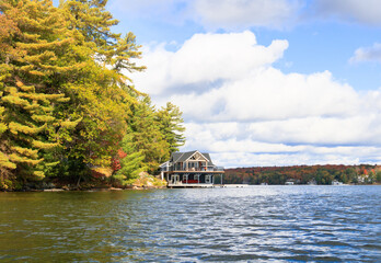 boat house over a lake in autumn