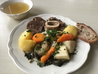 Homemade french pot-au-feu and its stock, a typical slow cooked beef and vegetables dish