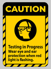 Caution Sign Testing In Progress, Wear Eye And Ear Protection When Red Light Is Flashing