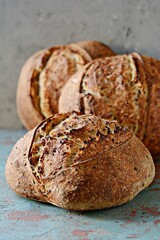 Homemade Freshly Baked Country Bread  made from wheat and whole grain flour on gray background. French Freshly baked bread. 