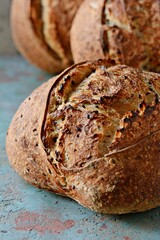 Homemade Freshly Baked Country Bread  made from wheat and whole grain flour on gray background. French Freshly baked bread. 