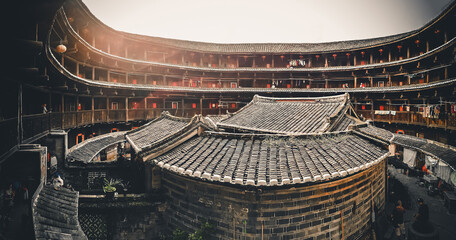 FUJIAN, CHINA &ndash; MARCH 2, 2018: A panoramic wide angle view of Tulou courtyard,Tulou is the unique traditional rural dwelling of Hakka.