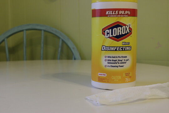 London Canada - January 01 2019: Editorial illustrative photo of a container of clorax wipes next to a used wipe. Clorox wipes are popular cleaning tools.