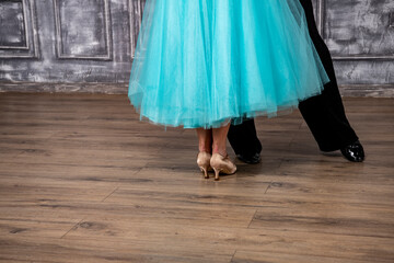 beautiful female legs in golden dance shoes