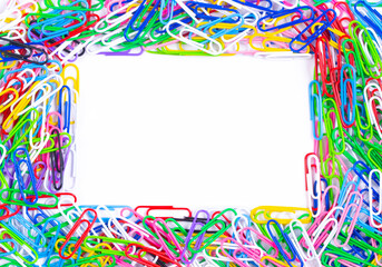 Frame made of colored bright paper clips on white background,top view with space for text or creativity. Frame.Close up
