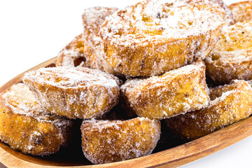 Dessert of bread known as golden slice, slice of lamb, french toast, Eggy bread, French toast, “Pain Perdu”. Isolated white background