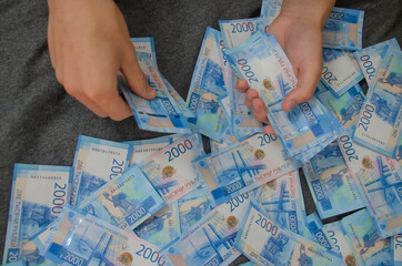 Money. Close-up of bills and hand.