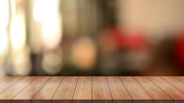 Empty wood top table with blur restaurant background.