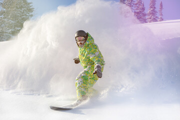 Snowboarder on snowboard rides through snow, explosion. Freeride in winter Ski Resort