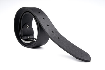 Fastened fashionable men's leather belt with dark matted metal buckle isolated on white background....