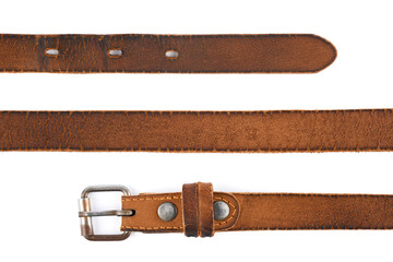 Old leather men's belt on a white background. Brown belt for men. Brown leather belt for trousers and jeans. Male accessory. Vintage things.  - obrazy, fototapety, plakaty