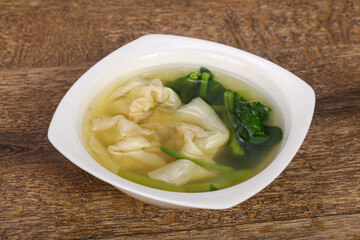 Asian traditional Wonton soup with herbs