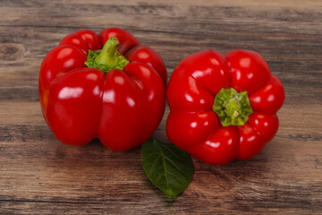 Ripe Red bell pepper over wooden