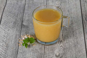 Dietary vegetarian oats milk over wooden