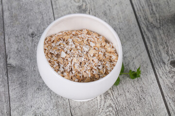 Raw oats in the bowl