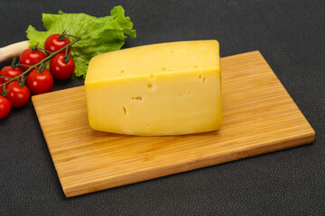 Hard yellow tasty cheese brick