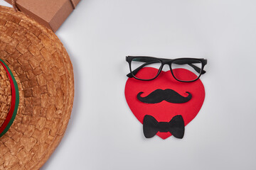 Red face made of glasses moustache and bow tie. Isolated on white background.