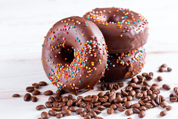 Chocolate gluten free donuts with coffee on a table