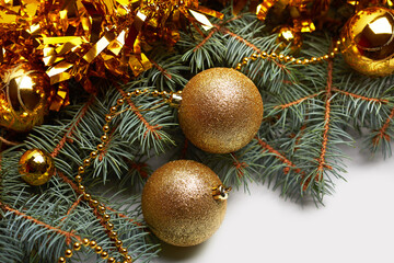 Gold Christmas decorations. Christmas background with xmas tree. Merry christmas card. Winter holiday theme. Happy New Year. Space for text. Happy Holidays 