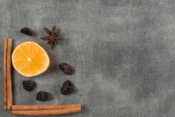 Mulled wine seasoning orange and cinnamon on a dark background.