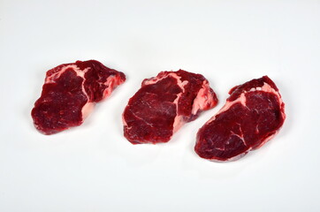 Fresh raw beef steak isolated on white background