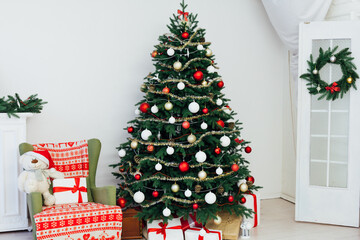 Christmas tree with fireplace presents the decor of the house New Year