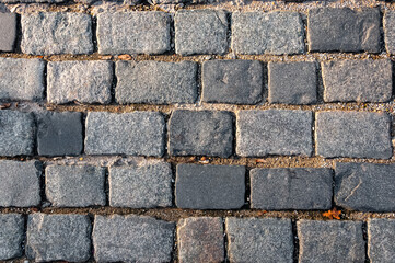Obraz premium The road is paved with stone, paving stones.