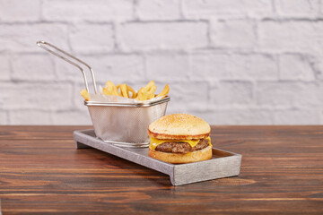Hamburger with cheddar cheese and fries