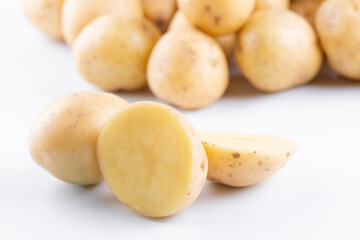 New raw potatoes isolated on white background close up
