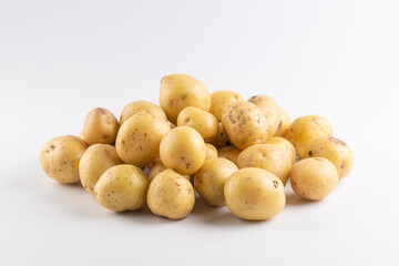 New raw potatoes isolated on white background close up
