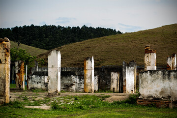 Ruins on a farm with mountains as background