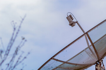 TV antenna under cloudy sky
