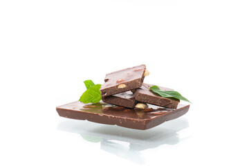 sweet dark chocolate with nuts on a white background