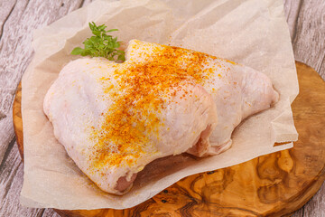 Raw chicken thigh with spices