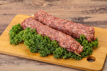 Raw minced beef kebab skewer