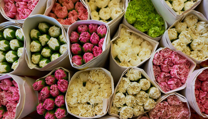 Beautiful bouquets of mixed flowers in a flower shop. A bright mix of flowers. Background on full screen. Handsome fresh bouquets. Flowers delivery. Floral shop concept . Selective focus.